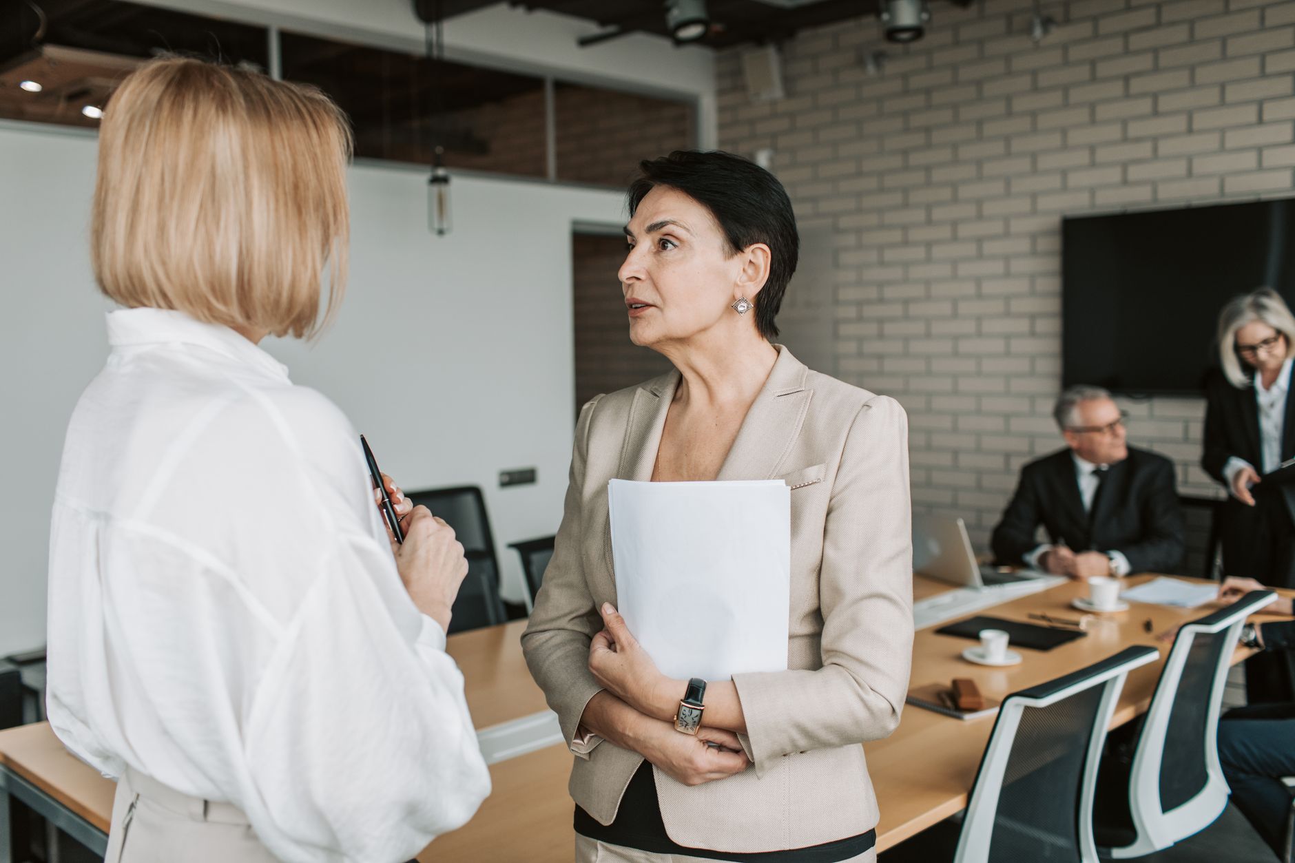 Business leaders coordinating during a crisis in a boardroom